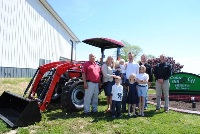 Case IH awarded Kirk and Stephanie Liefer of Red Bud, Ill., a new Case IH Farmall® 65A tractor. The tractor was delivered and will be supported by local Case IH dealer Mascoutah Equipment. As a finalist for the Young Farmers & Ranchers Achievement Award, the Liefers were selected based on the success of their operation combined with the strength of their leadership skills. Pictured left to right are John Kaiser, Sales Representative, Mascoutah Equipment; Stephanie and Kirk Liefer; Eric Thomas, Case IH Territory Sales Manager; and Rob Stookey, Sales Manager, Mascoutah Equipment. Case IH awarded Kirk and Stephanie Liefer of Red Bud, Ill., a new Case IH Farmall® 65A tractor. The tractor was delivered and will be supported by local Case IH dealer Mascoutah Equipment. As a finalist for the Young Farmers & Ranchers Achievement Award, the Liefers were selected based on the success of their operation combined with the strength of their leadership skills. Pictured left to right are John Kaiser, Sales Representative, Mascoutah Equipment; Stephanie and Kirk Liefer; Eric Thomas, Case IH Territory Sales Manager; and Rob Stookey, Sales Manager, Mascoutah Equipment.