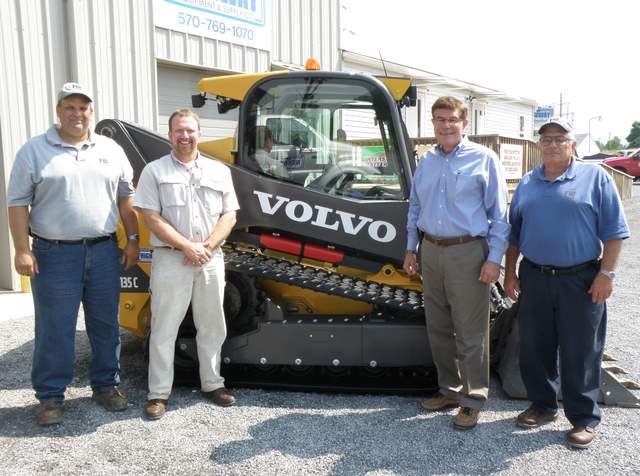 Matt Shoemaker, Chris Sauers, Russ Fairchild and Guy Fairchild of Fairchild Brothers proudly stand in front of their new Volvo MCT135C compact track loader. 